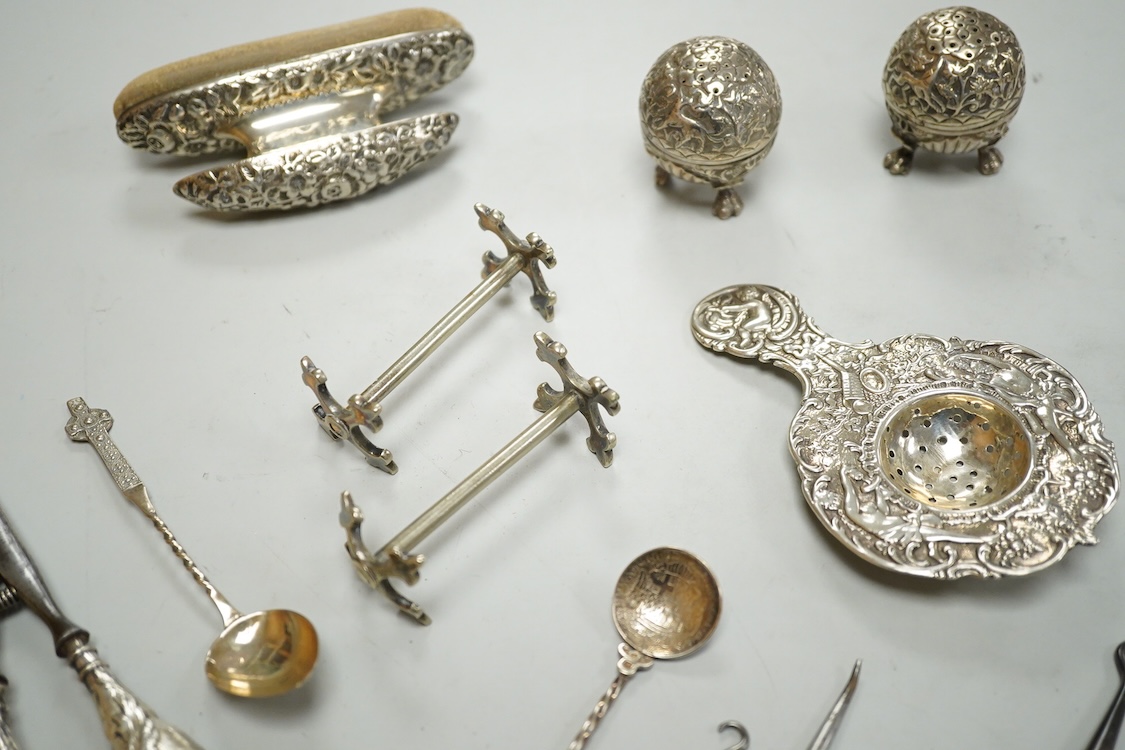 Sundry small silver and white metal items including a pair of Indian condiments, a nail buffer, two pairs of glove stretchers, a tea strainer, two spoons, a pair of plated knife rests, etc.